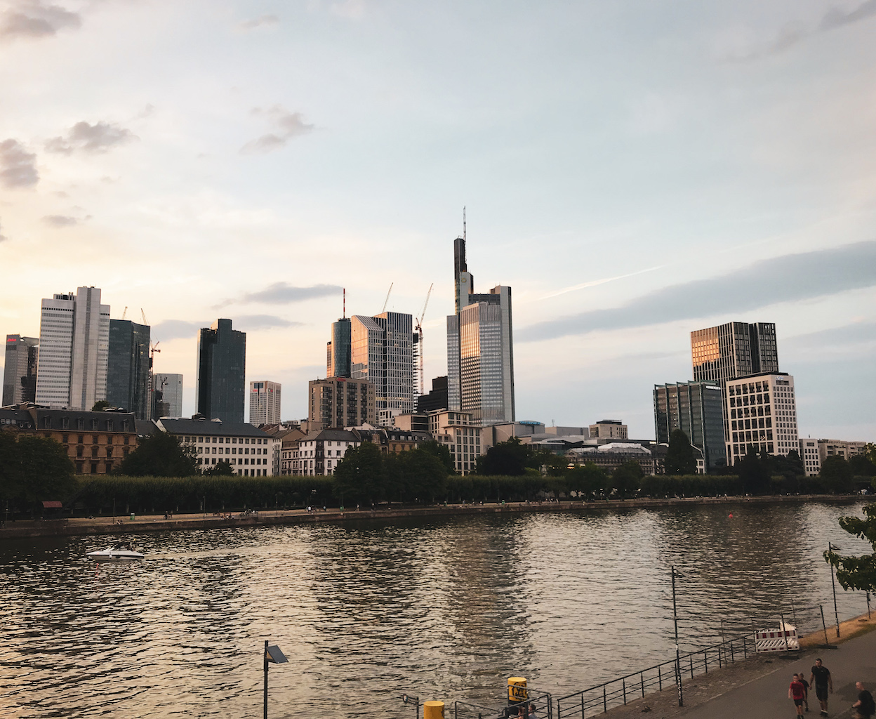 People walking along the river in Frankfurt am Main, Germany.