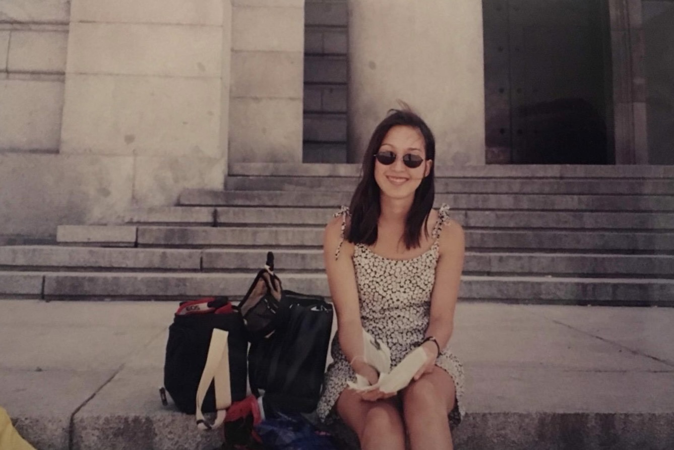 Mali shares her Eurail story: Girl sitting outside on some stairs of an old building. The phot was taken back in the 90s 