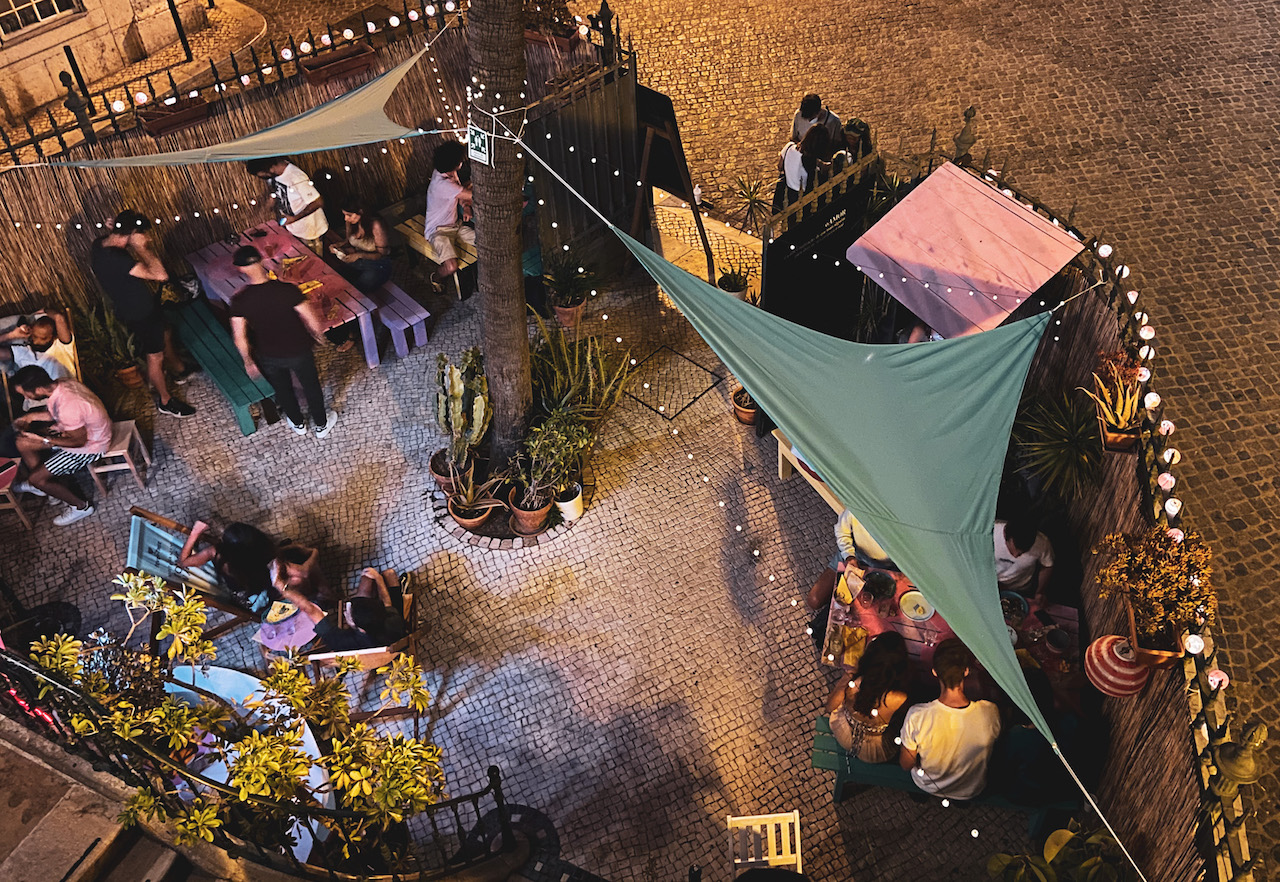 A crowd of young people enjoying the nightlife in Barrio Alto in Lisbon, Portugal at Oasis Backpackers Mansion
